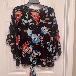 Jodifl oversized v-neck blouse with a tie in the front.